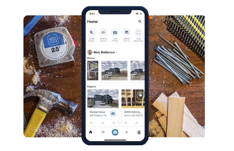 A view of CompanyCam on a phone screen, as if on a worker’s workbench.